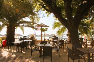 Outdoor Lounge of Swell Beach Bar - Gold Sun Reflections